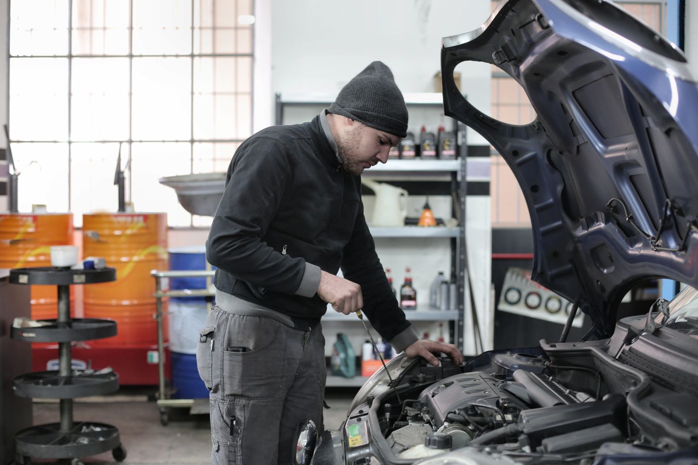 A mechanic checking an engine
